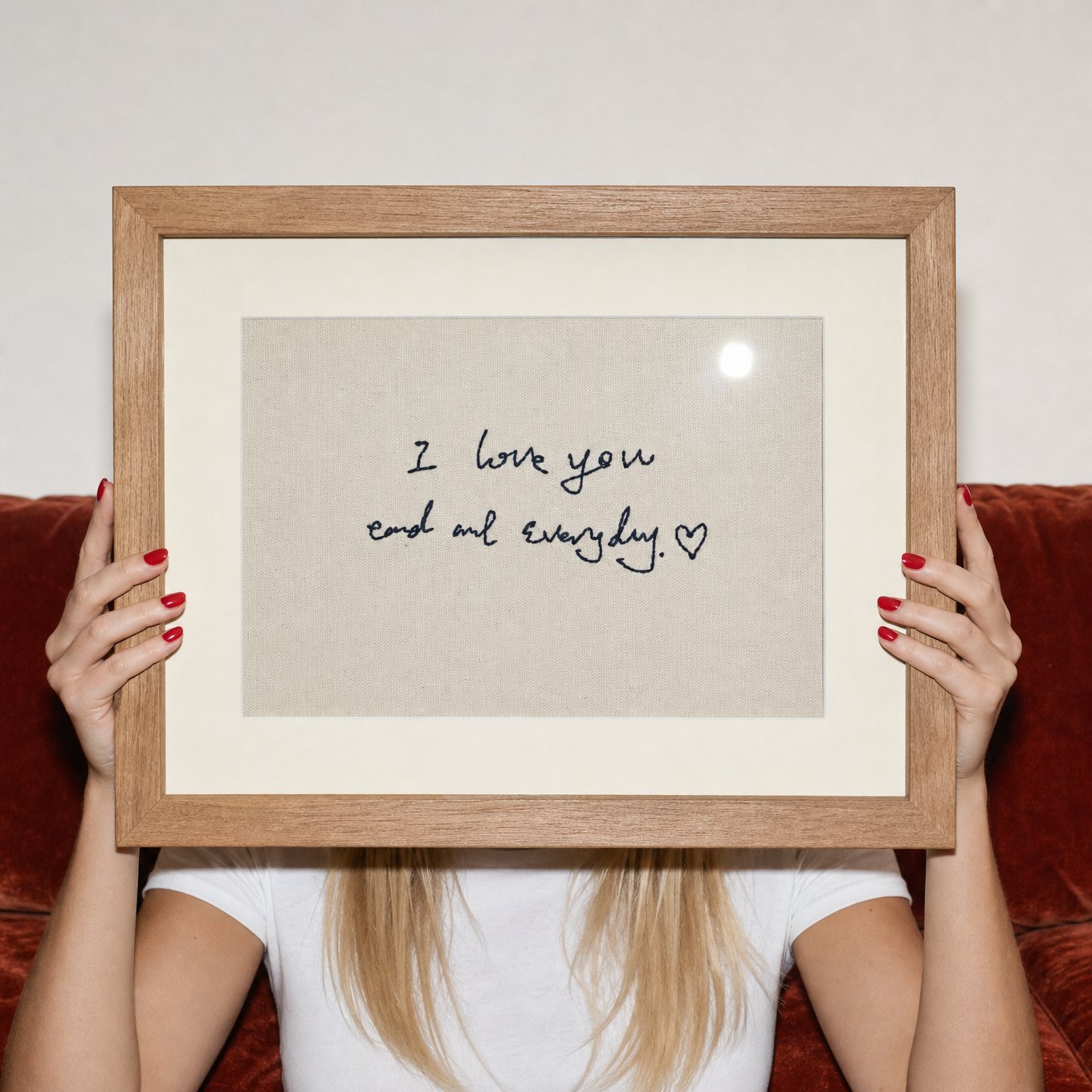Framed embroidered piece reading "I love you and every day"